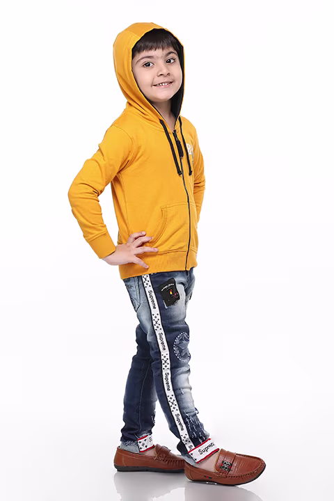 Boy in yellow hoodie and jeans – kidswear photo by Adzo Studio